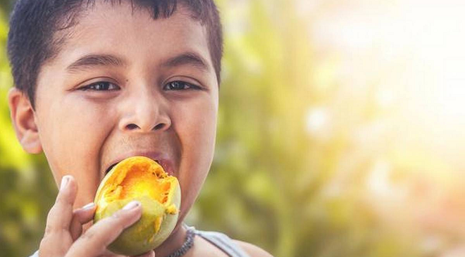 child eating mango inmarathi